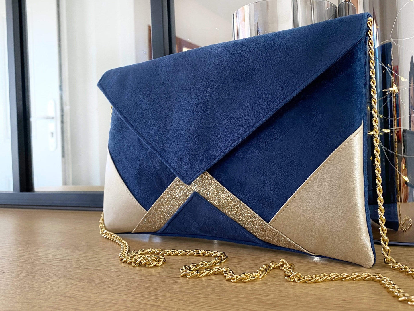 Fil des toiles Pochette Pochette de soirée bleu marine et doré clair