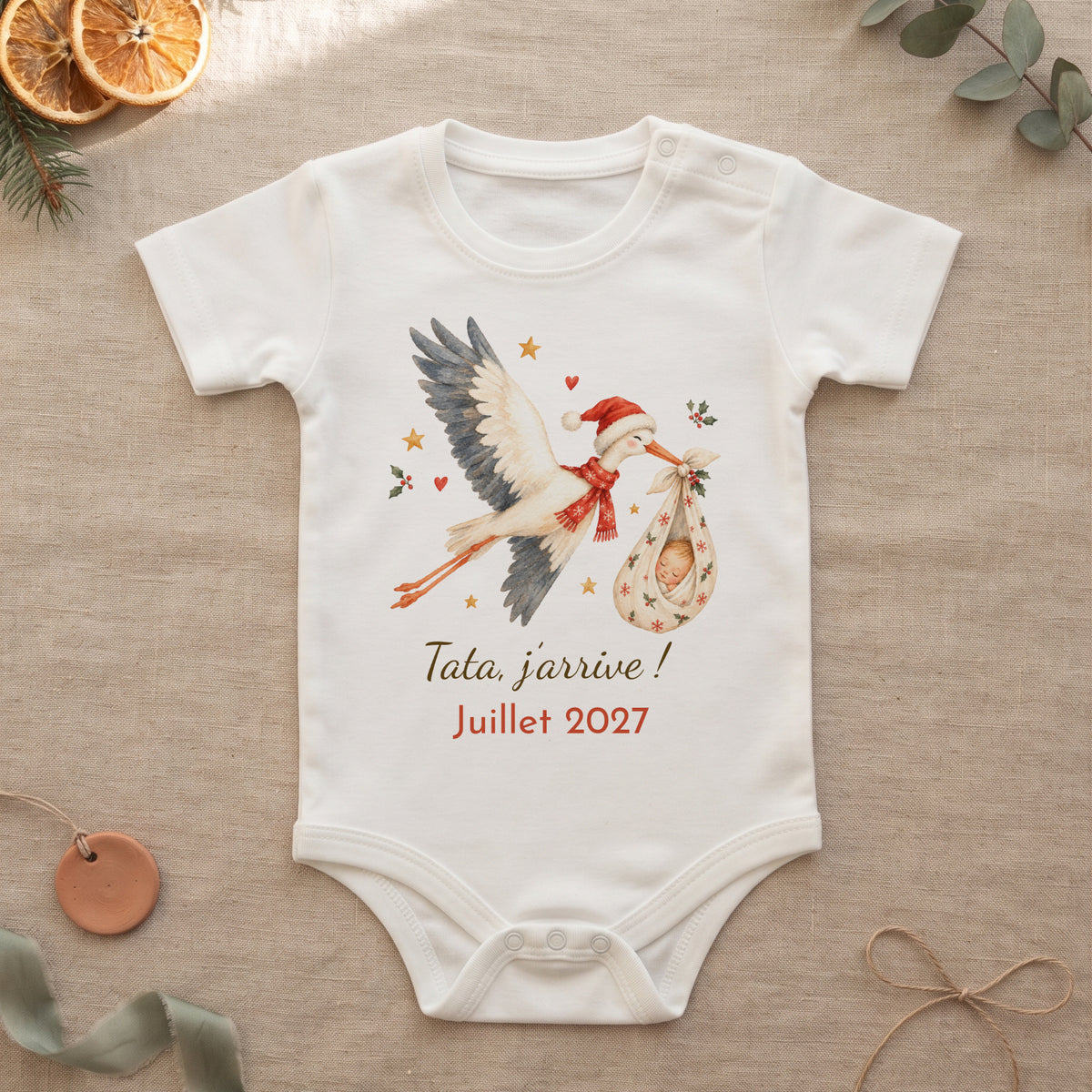 Body annonce grossesse cigogne de Noël avec le message Tata, j'arrive ! Juillet 2027,