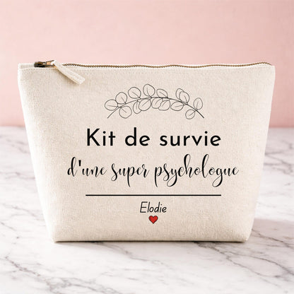 Trousse personnalisée Kit de survie d'une super psychologue, coloris naturel, posée sur marbre