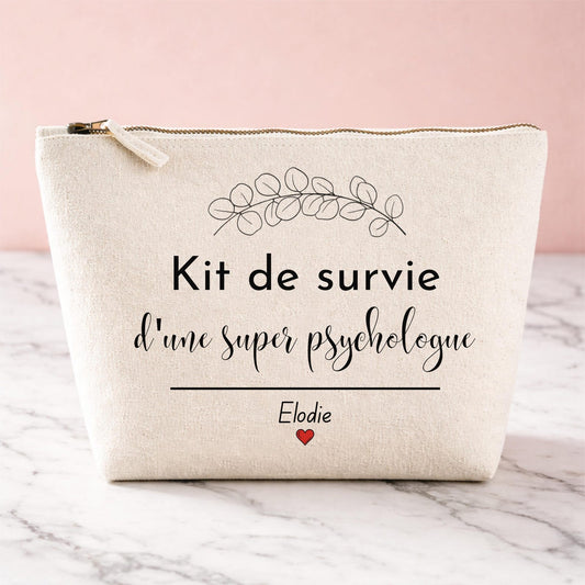 Trousse personnalisée Kit de survie d'une super psychologue, coloris naturel, posée sur marbre